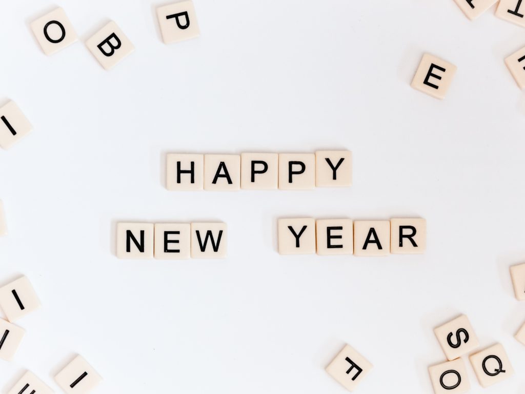 Scrabble tiles spelling out Happy New Year